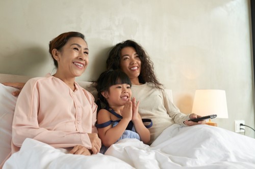 mom and daughter watching movie
